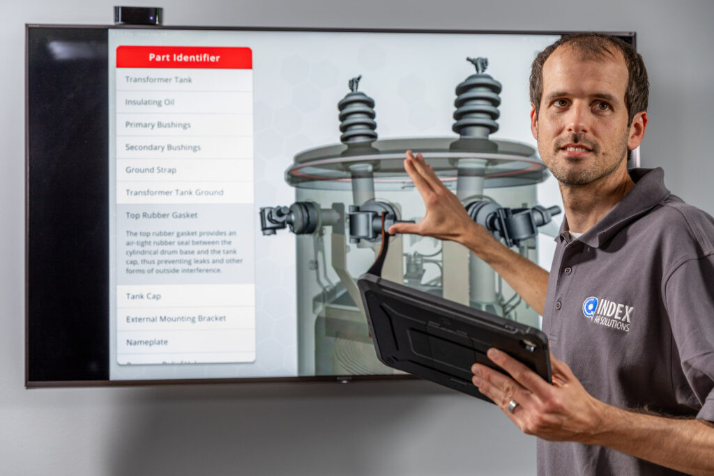 College instructor using 3D visualization of utility transformer
