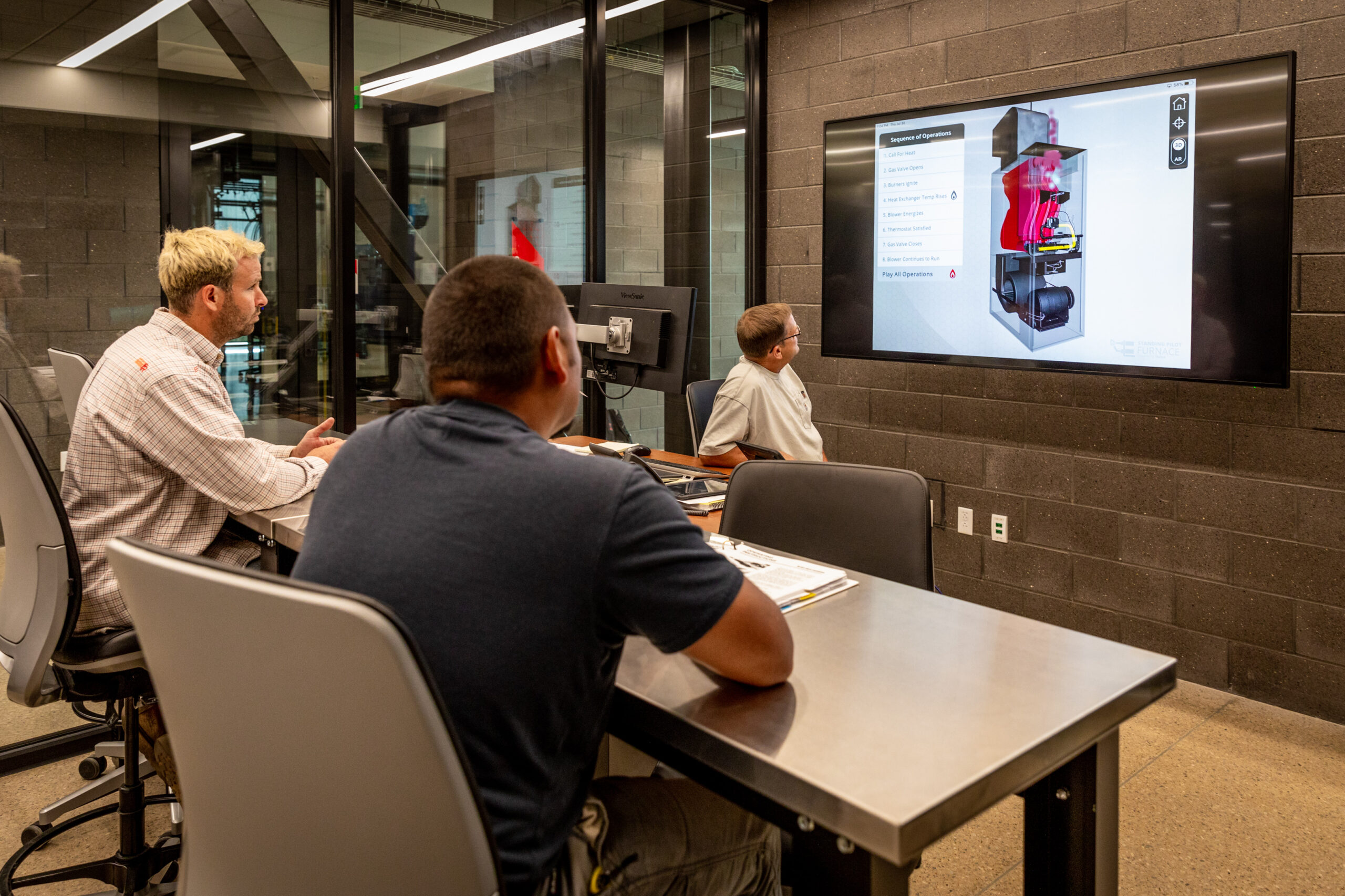 College students viewing AR app in classroom