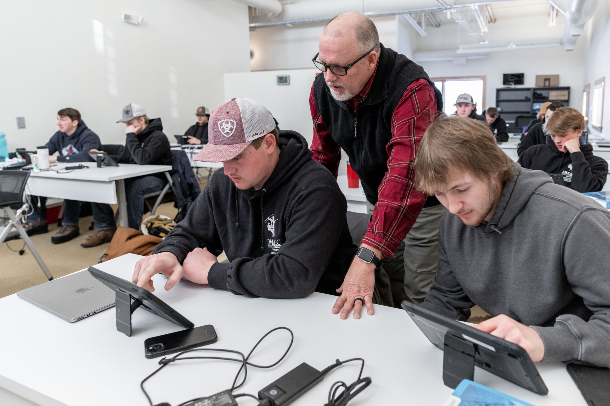 Instructor with students and tablets