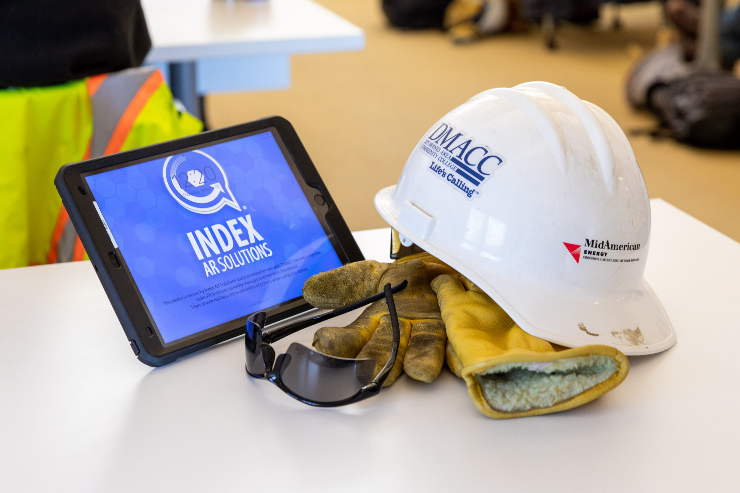 Hard hat with gloves and tablet