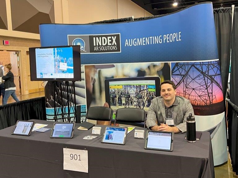 Index AR Solutions representative in conference booth