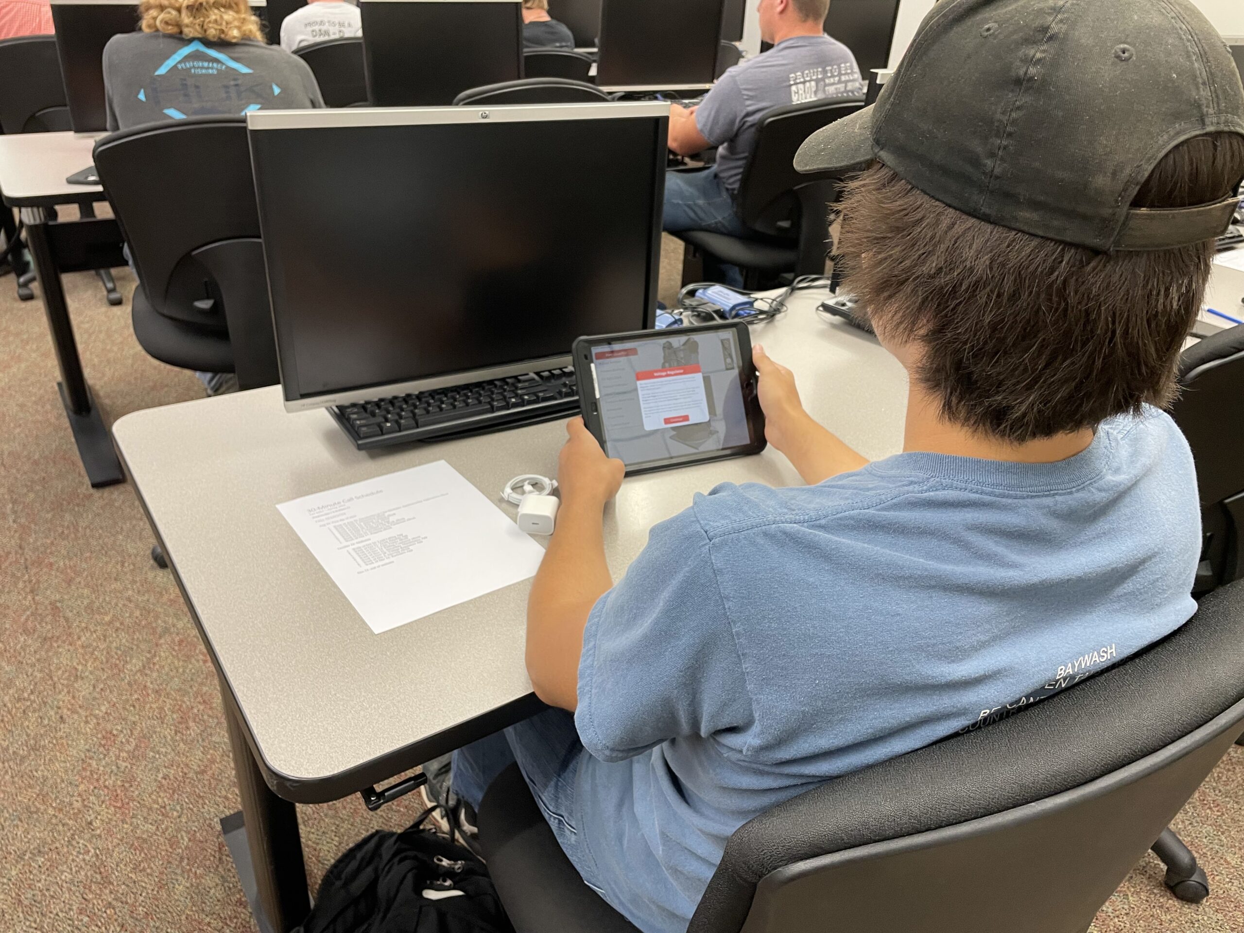 Student Using Tablet at Desk