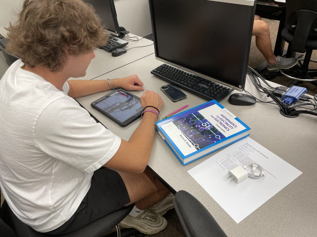 College Student Using Tablet in Classroom