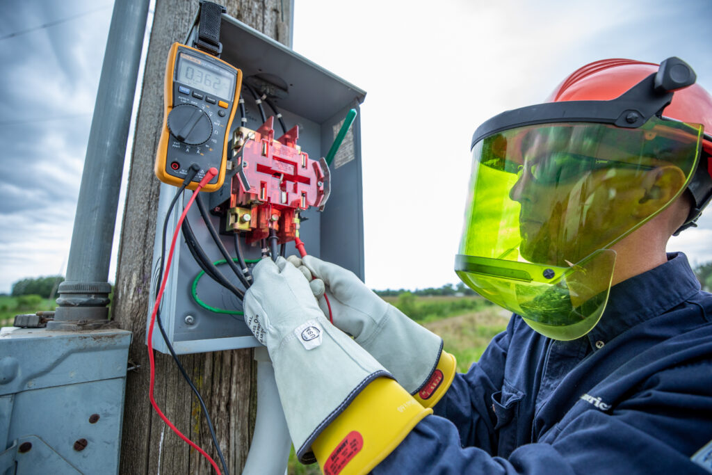 Electric worker at meter