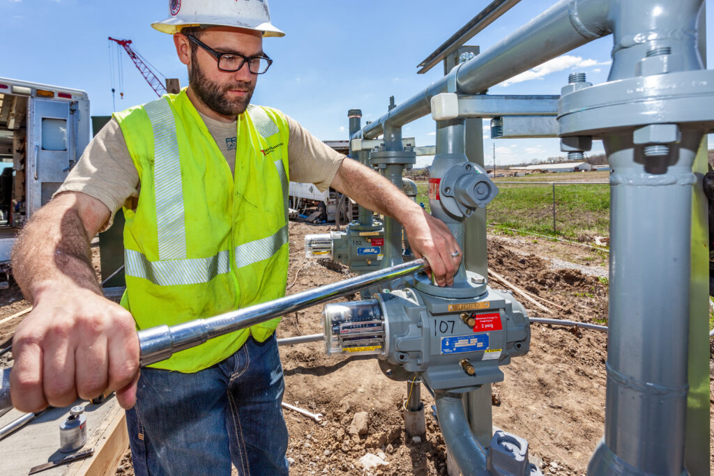 Gas worker installing rotary meter