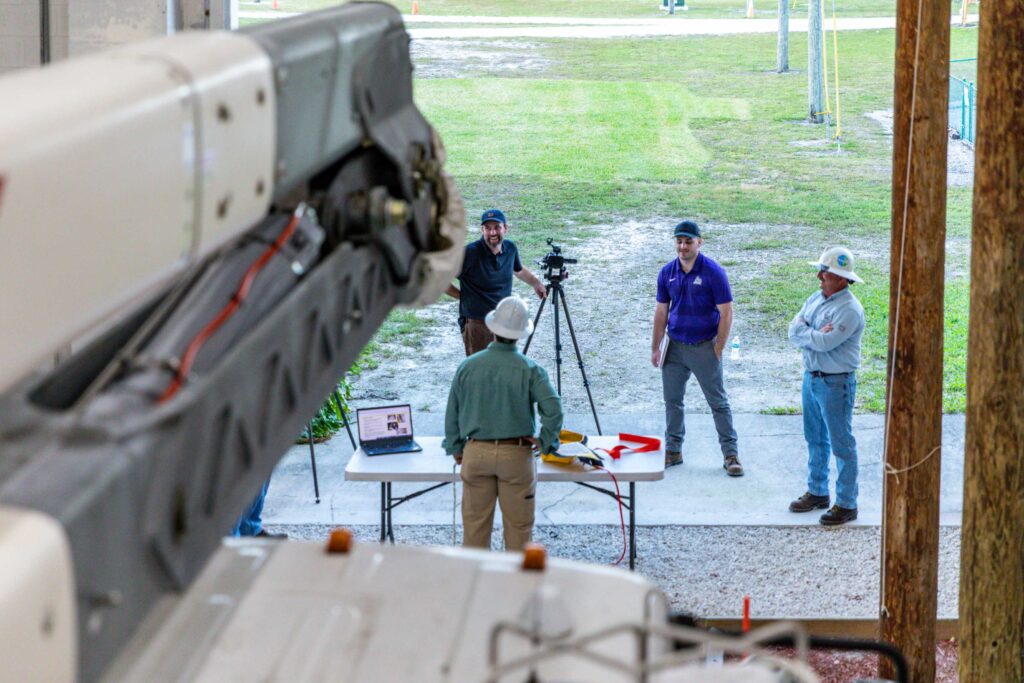 Videographer filming utility workers
