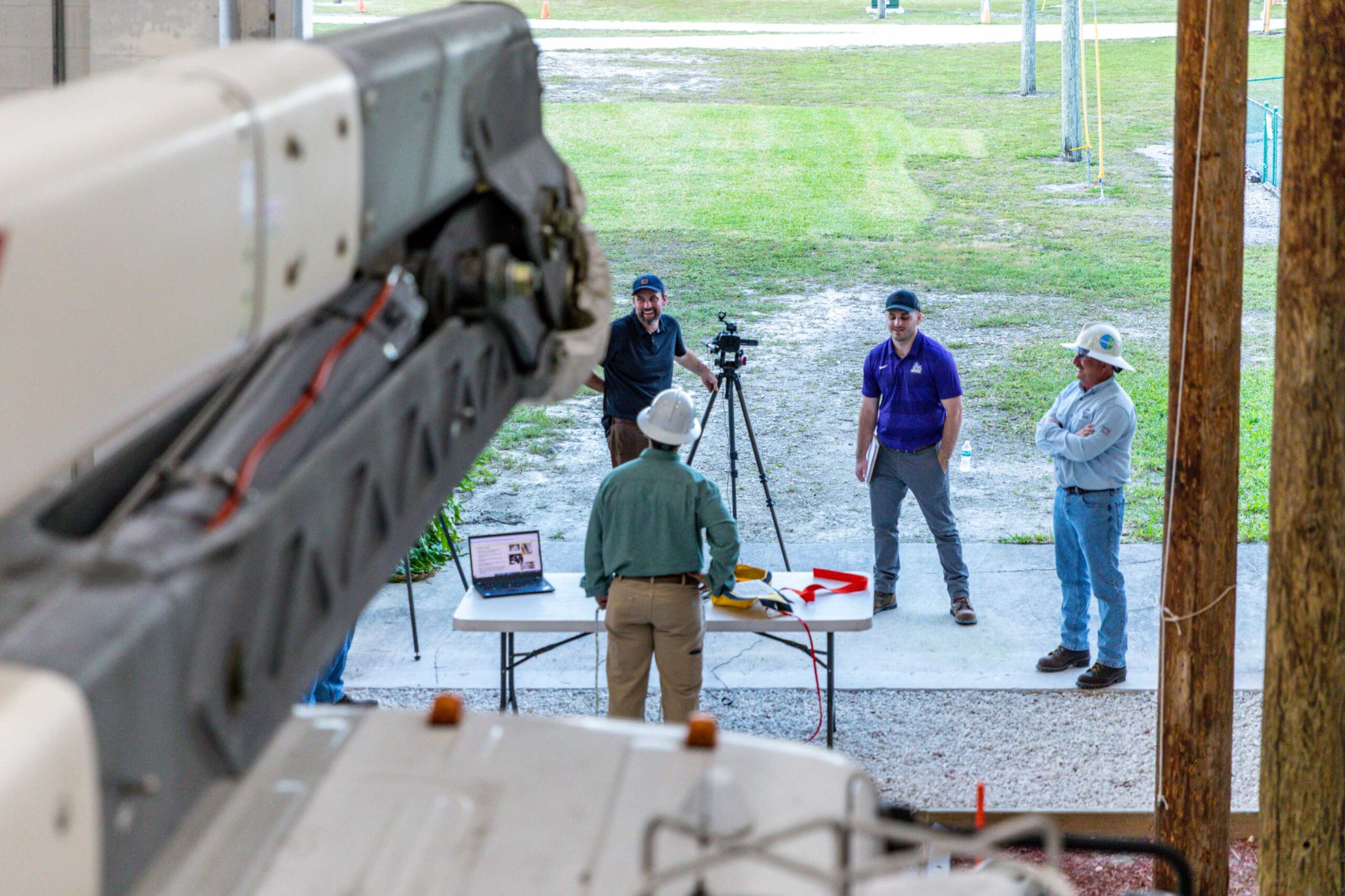 Videographer filming utility workers